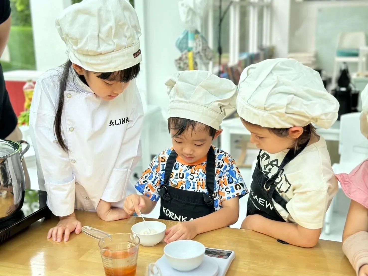 A child measuring ingredients