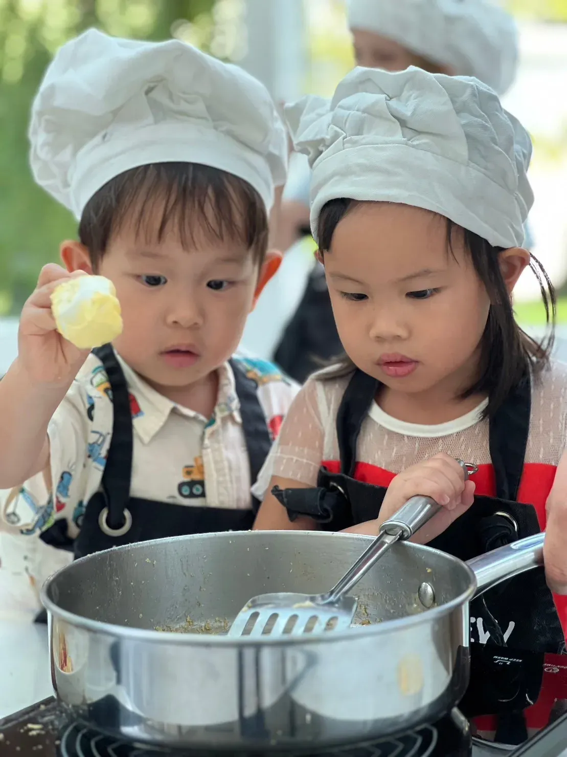 Children mixing a recipe together